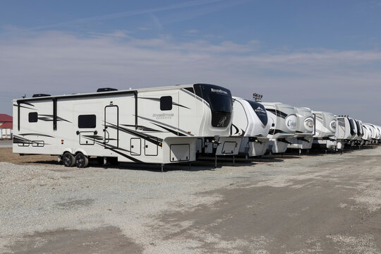 Various Fifth Wheel Recreational RV Vehicles on display at a dealership.