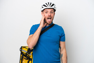 Young brazilian man with thermal backpack isolated on white background with surprise and shocked facial expression