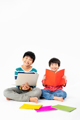 Portrait of Happy asian boys, Brother on floor with laptop and books isolated on white background, Education and learning with technology concept