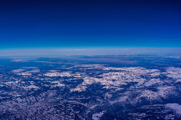Fototapeta na wymiar Aerial view of snow covered mountains