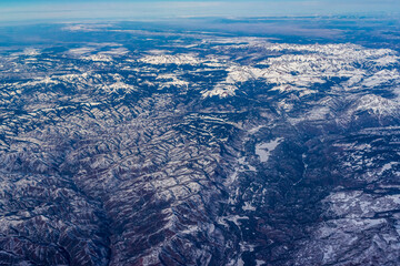 Aerial view of snow covered mountains