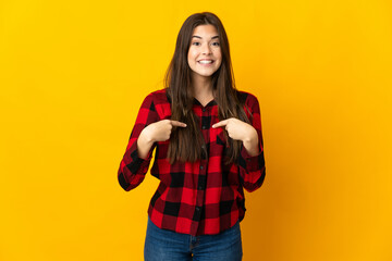 Teenager Brazilian girl isolated on yellow background with surprise facial expression