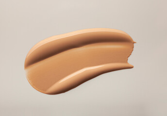 Make up smear foundation smudge texture beige isolated background