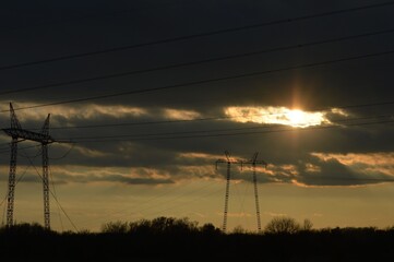 orange sunset and electric poles