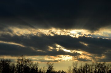 the sunset is orange and the rays of the sun