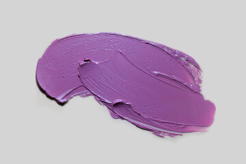 Lipstick abstract strokes smudge  background texture pinky purple colored isolated on grey