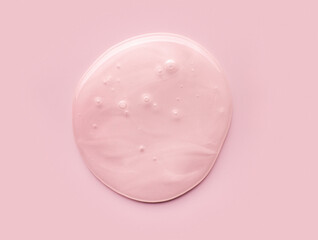 Pink mother of pearl cosmetic product drop texture pink background