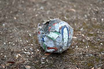 The old soccer ball is abandoned.
