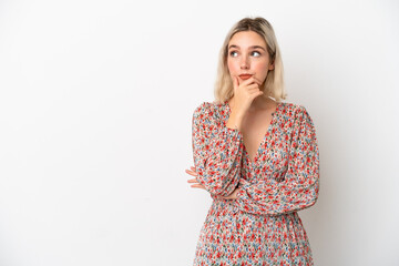 Young caucasian woman isolated on white background having doubts and with confuse face expression