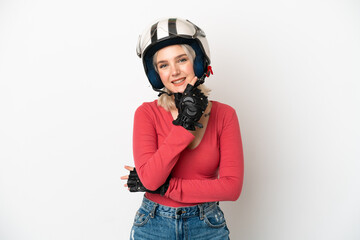 Young caucasian woman with a motorcycle helmet isolated on white background happy and smiling