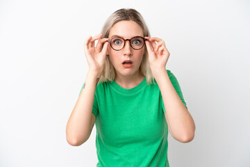 Young caucasian woman isolated on white background With glasses and frustrated expression