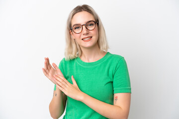 Young caucasian woman isolated on white background With glasses and applauding