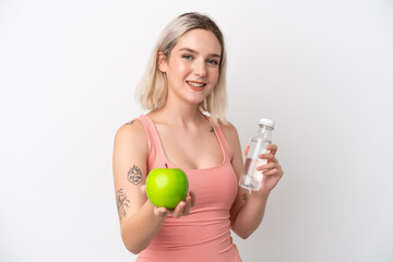 Young caucasian woman isolated on white background with an apple and with a bottle of water