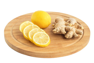 On the kitchen light board lies a ginger root with sliced lemon and whole.