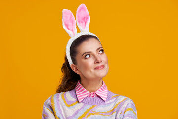 Studio shots of woman over yellow background easter style
