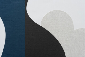 paper design in blue, black, and gray on white