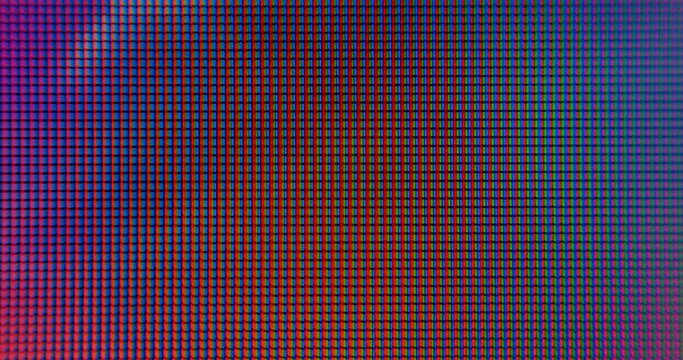 Fast flashing multi-colored light on the pixel screen. Dynamic background in video effect. The blue color changes to orange. To attract attention.