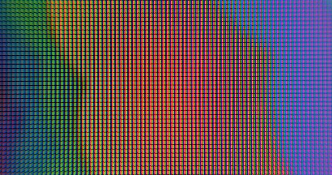 Slow motion rainbow color on pixel monitor. Dynamic background. Stripes of blue, orange, red colors.