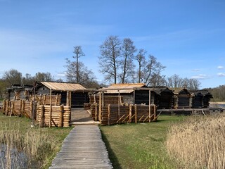Fototapeta na wymiar Araishi lake wooden fort on a sunny spring day. Latvia, Gauja National Park in Cesis region.