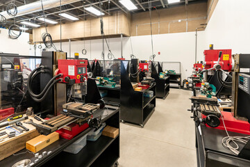 Interior of a shop class, machine shop, lathe, drills