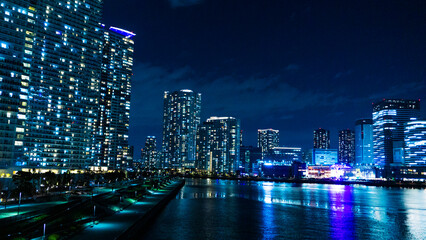 Night view of a high-rise condominium along an urban river_21