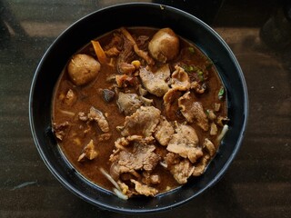 Corned Beef Tenderloin with thickened soups and meat balls in a cup. focus a point of object.