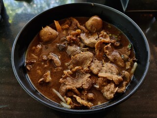 Corned Beef Tenderloin with thickened soups and meat balls in a cup. focus a point of object.
