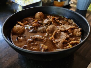 Corned Beef Tenderloin with thickened soups and meat balls in a cup. focus a point of object.