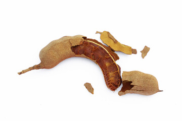 Pile of tamarind fruits on white background. Top view. Flat lay.
Sticky brown acidic pulp from the pod of a tree of the pea family, widely used as a flavoring in Asian cooking.