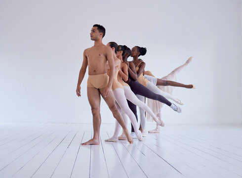 Bated breath at its finest. Shot of a group of ballet dancers practicing a routine in a dance studio.