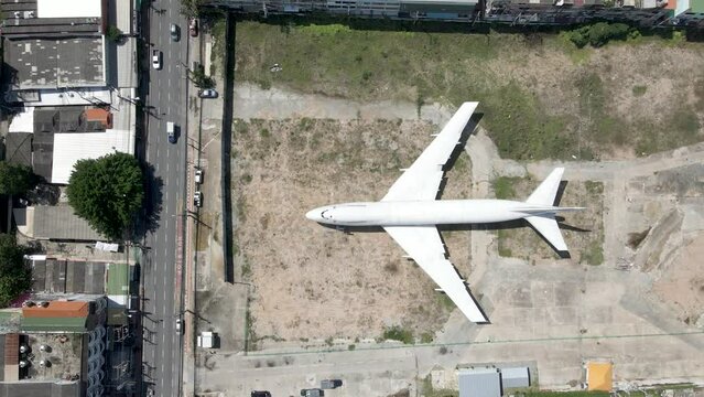 Topdown view old Jumbo Jet abandoned in the city, Pattaya Downtown, Thailand