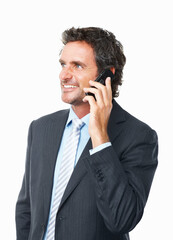 Mobile phone conversation. Handsome mature business man talking on cellphone against white background.