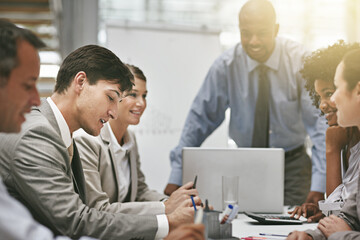 Putting their ideas on the table. Cropped shot of a group of businesspeople meeting in the boardroom.