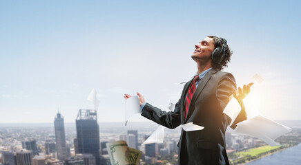 Young businessman with headphones