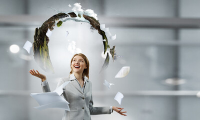 Business woman with papers and books around her