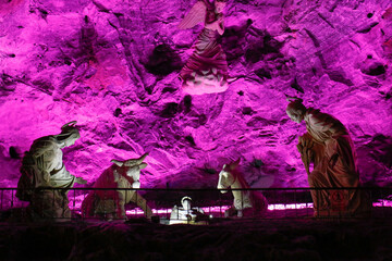 Holy Family sculpture at the Salt cathedral of Zipaquira illuminated in pink, Colombia