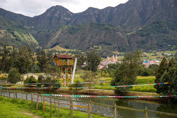 Fototapeta premium View to historic town Zipaquirá with a river in front and forested mountains in the back, Cundinamarca, Colombia