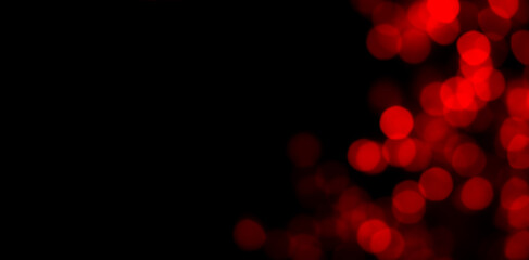 Abstract blur image of red light of beautiful bokeh on black banner background with copy space....