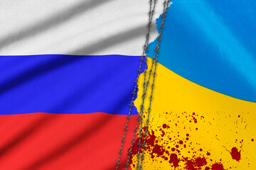 Grunge flags of Russian Federation and Ukraine divided by barb wire with blood splatters. War...