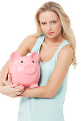 Protective of her money. A gorgeous young woman hugging her piggy bank protectively while isolated on a white background.