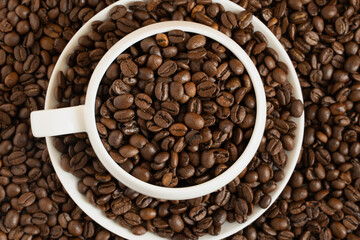 coffee bean foot background with ceramic cup and saucer