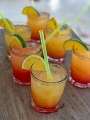 Detail of tropical cocktails on wooden surface