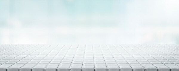 Empty white ceramic mosaic table top and blurred bokeh background - can used for display or montage...