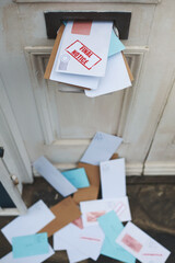 Crammed with correspondence. Cropped shot of letters in a letter box.