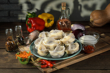 close up view of delicious food, dumplings and vegetables on wooden table