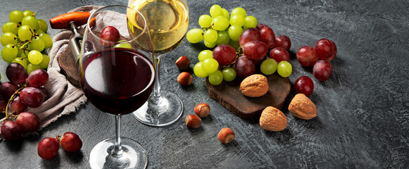 Different wine in glasses on gray background.