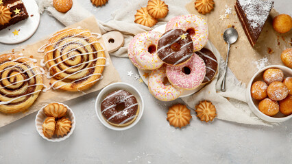Desserts assortment on light background.