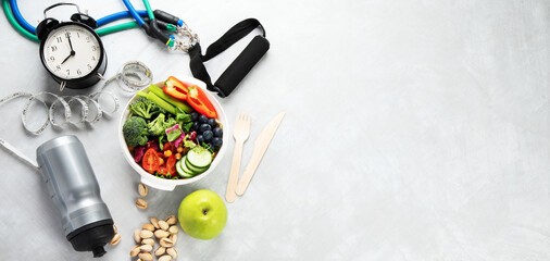 Healthy food and exercising equipment.