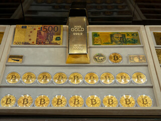 bitcoin and gold bullion at jewelery counter