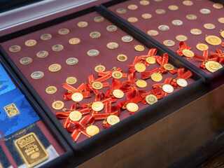 Turkish quarter gold coin with red ribbon
